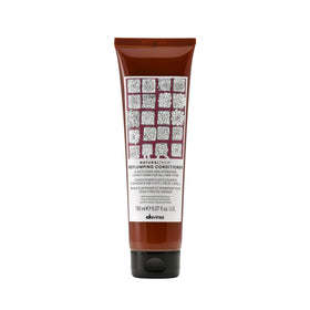 Davines replumping conditioner front packaging showing product and brand benefits