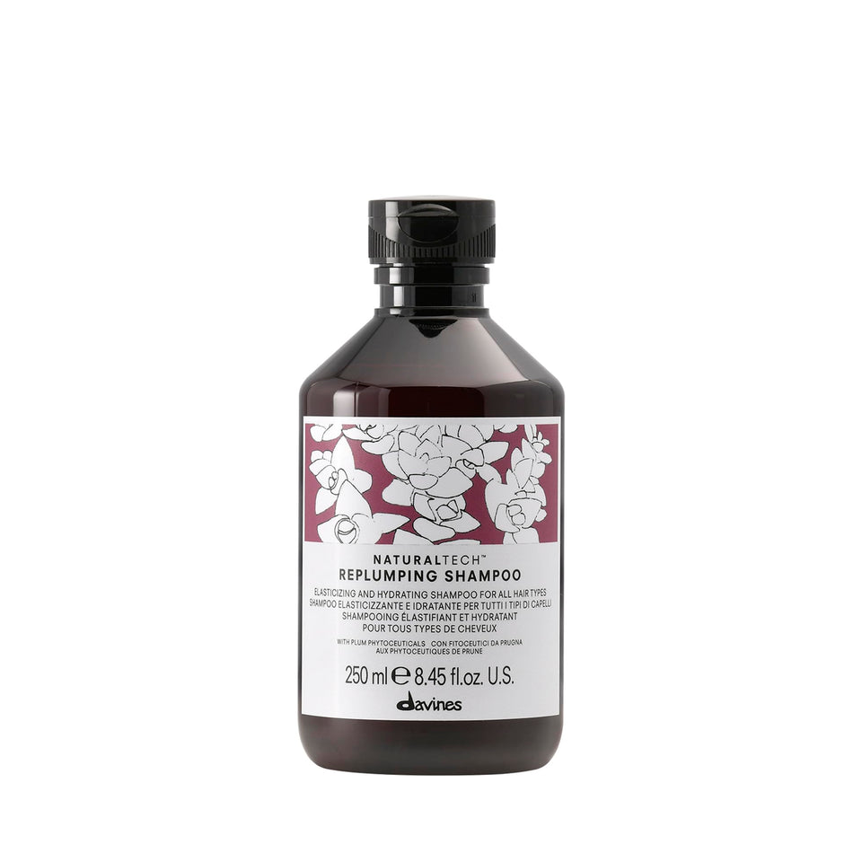 Davines bottle front view showing replumping shampoo for fuller hair benefits