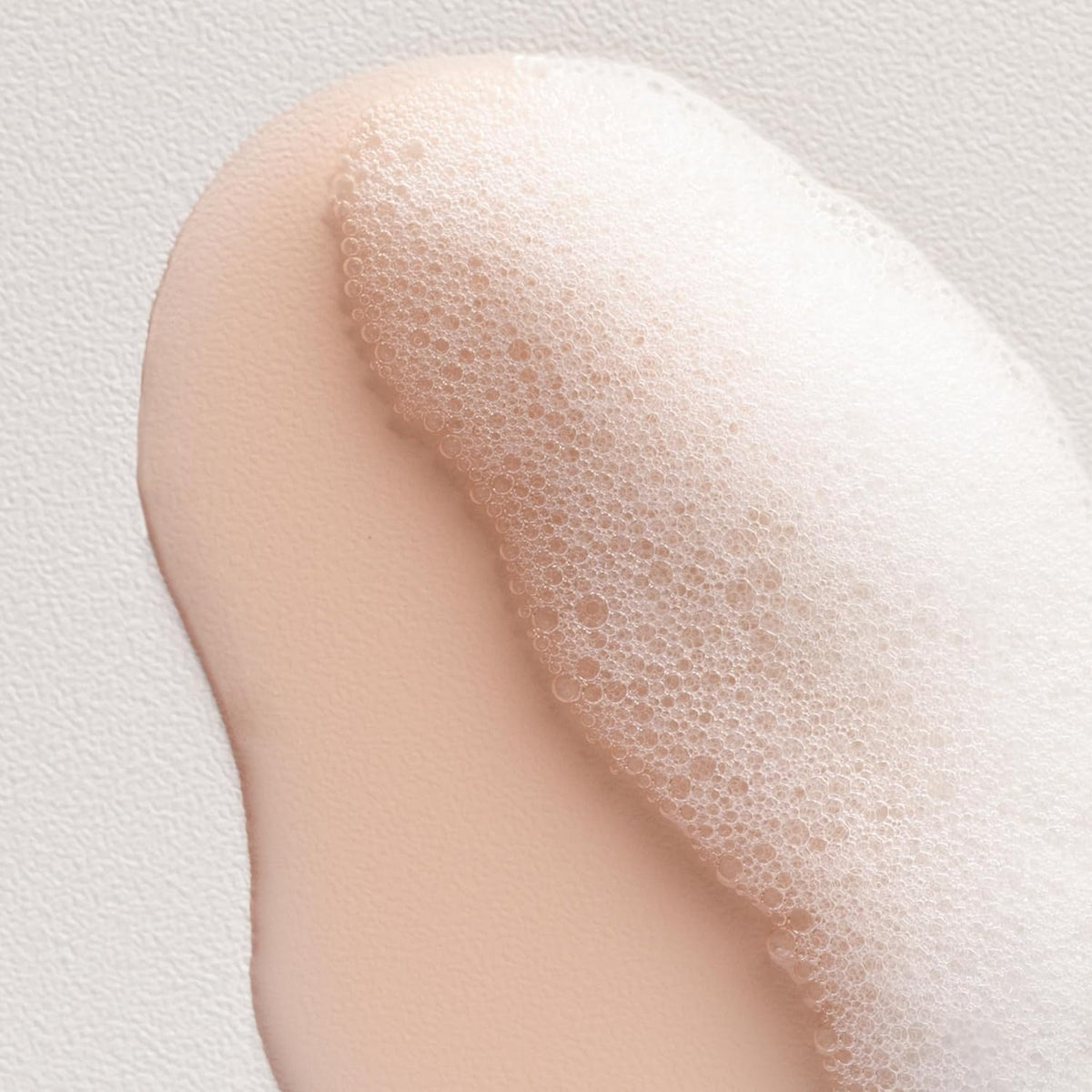 Davines shampoo on hand showing texture and easy application benefit