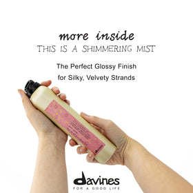 Davines mist in hand showing size and easy application benefit
