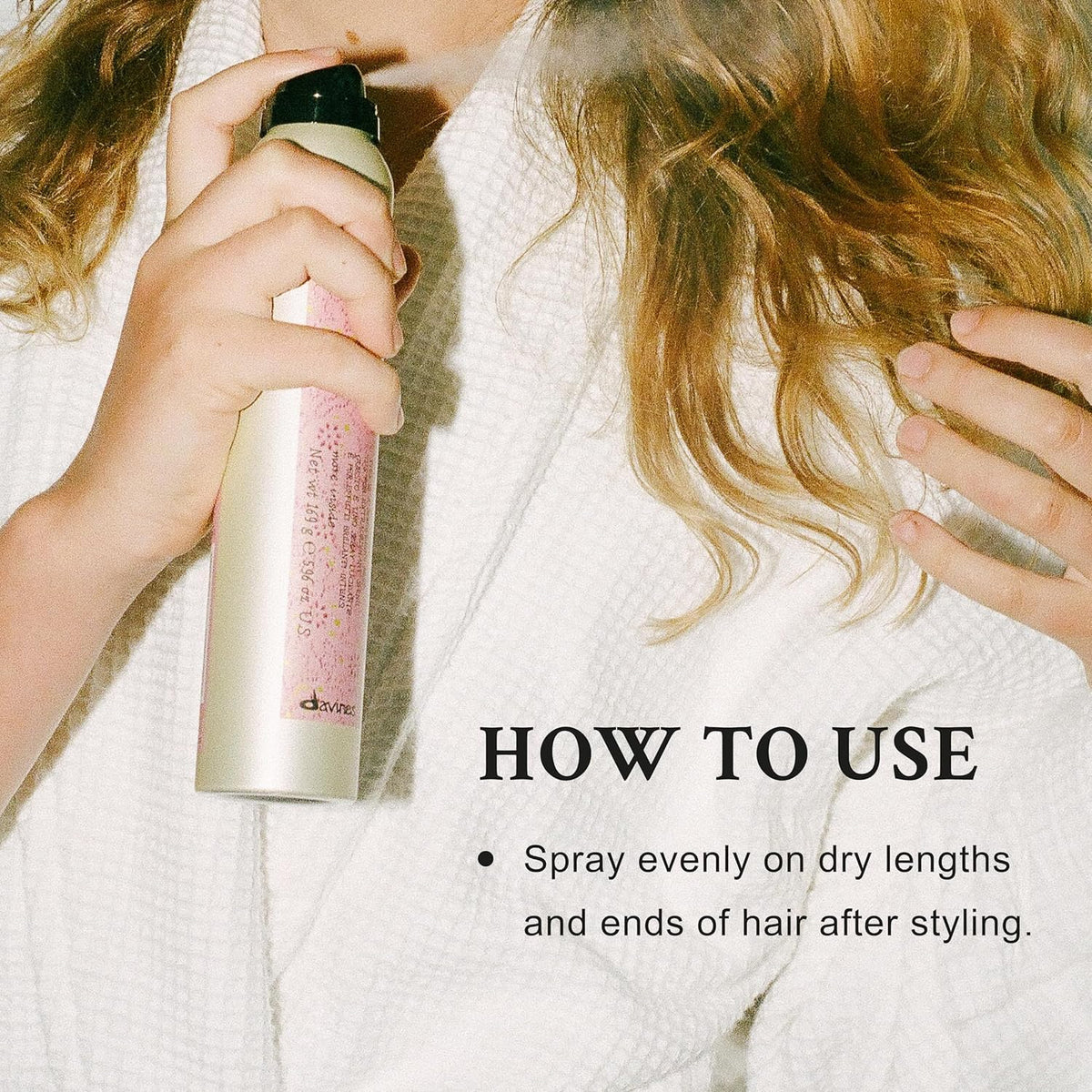 Davines mist being sprayed on hair to reduce frizz and boost shine