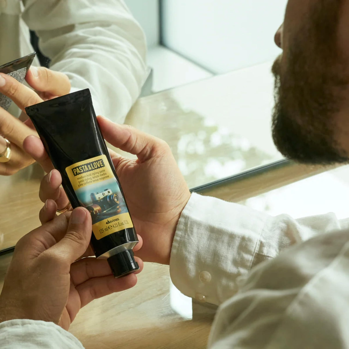 Davines side profile hairstyle in use showing definition benefit