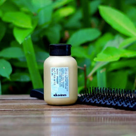 Davines compact size inside travel bag highlighting portability and on-the-go use