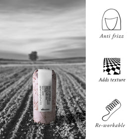 Close-up serum drop on fingertip showing silky texture and easy spreadability from Davines