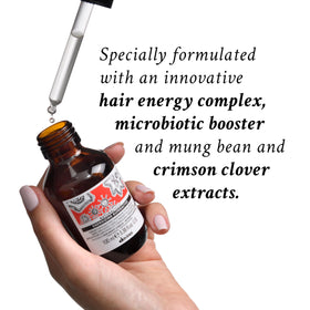 davines bottle in hand shows travel size convenience and portable use