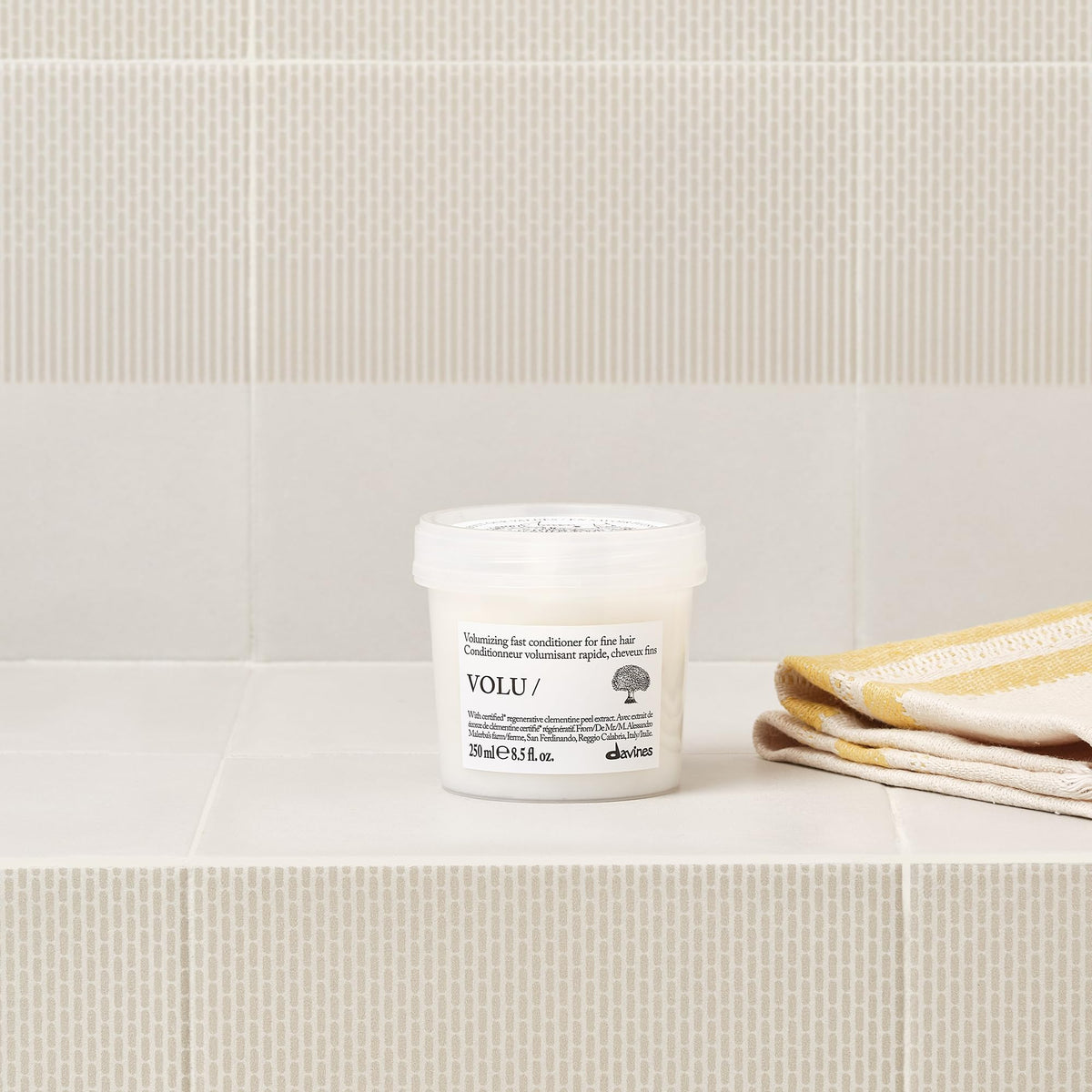 Davines VOLU/ clementine extract close-up emphasizing natural-derived volume support