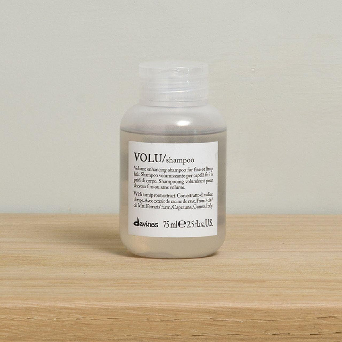 Davines VOLU shampoo cap detail demonstrating secure travel-friendly closure and portability