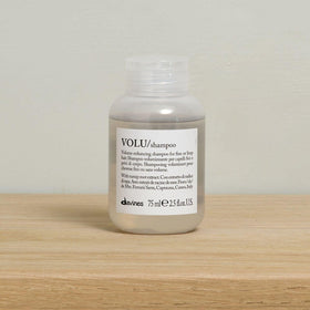 Davines VOLU shampoo cap detail demonstrating secure travel-friendly closure and portability