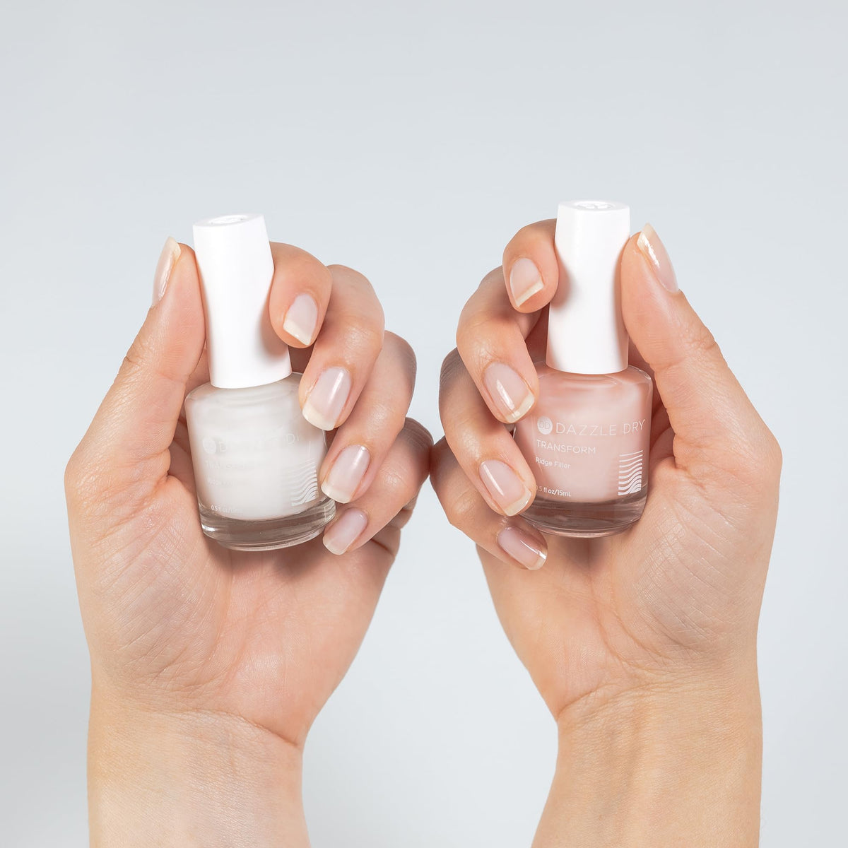 Dazzle Dry ridge filler pictured with Nail Prep and Top Coat showing system compatibility