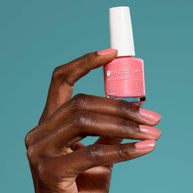 Dazzle Dry bottle shown next to hand for size and grip reference benefit