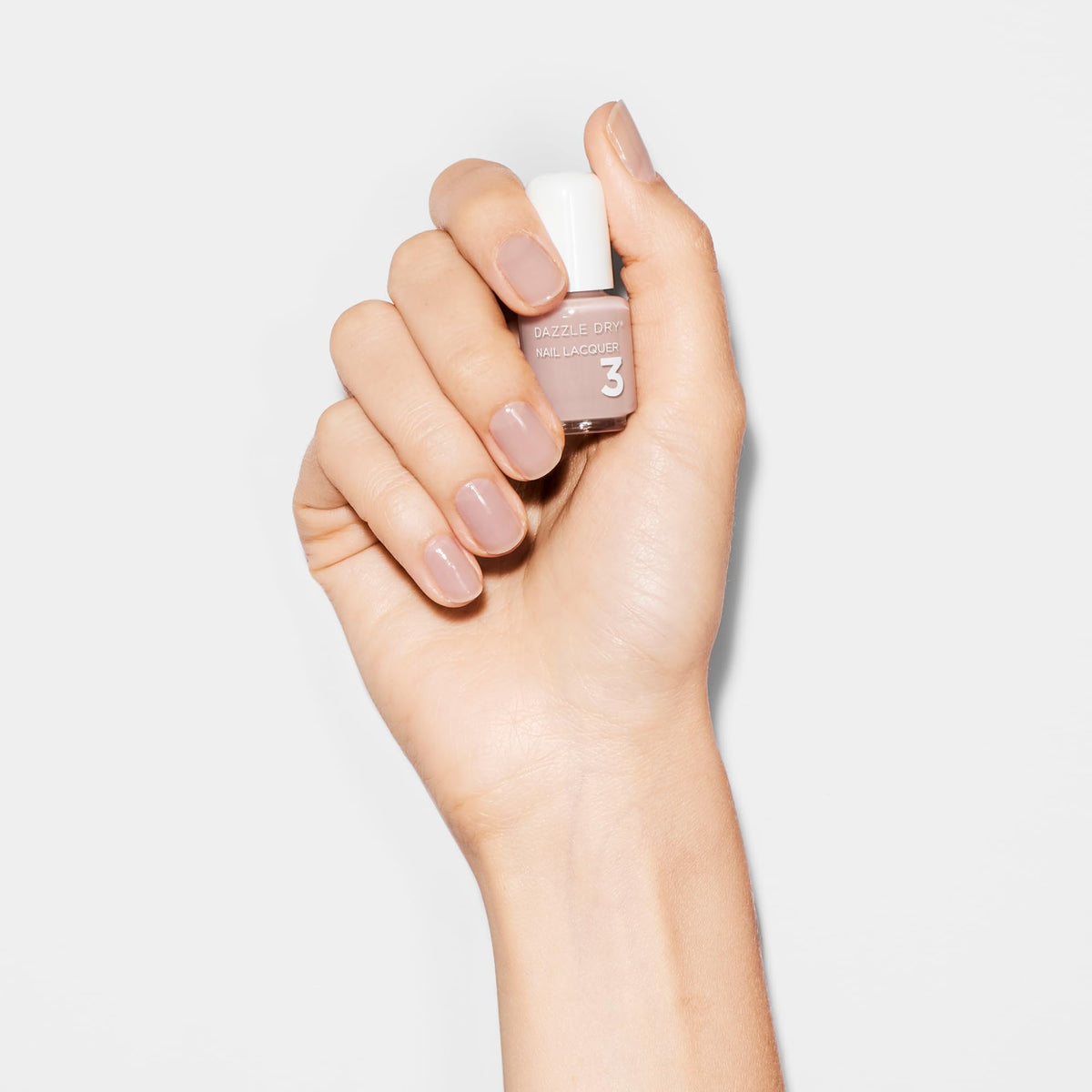 Dazzle Dry Chiffon Moment lacquer bottle highlighting sheer warm taupe finish