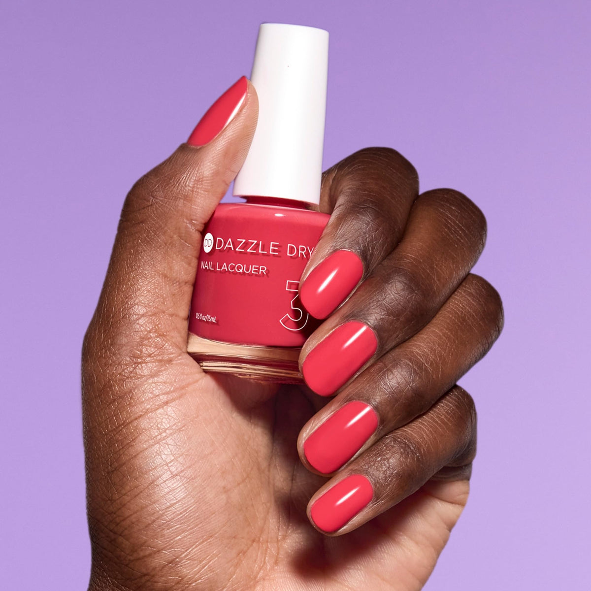 Hand model wearing Dazzle Dry "Let's Get Away" for long-lasting, salon-quality look