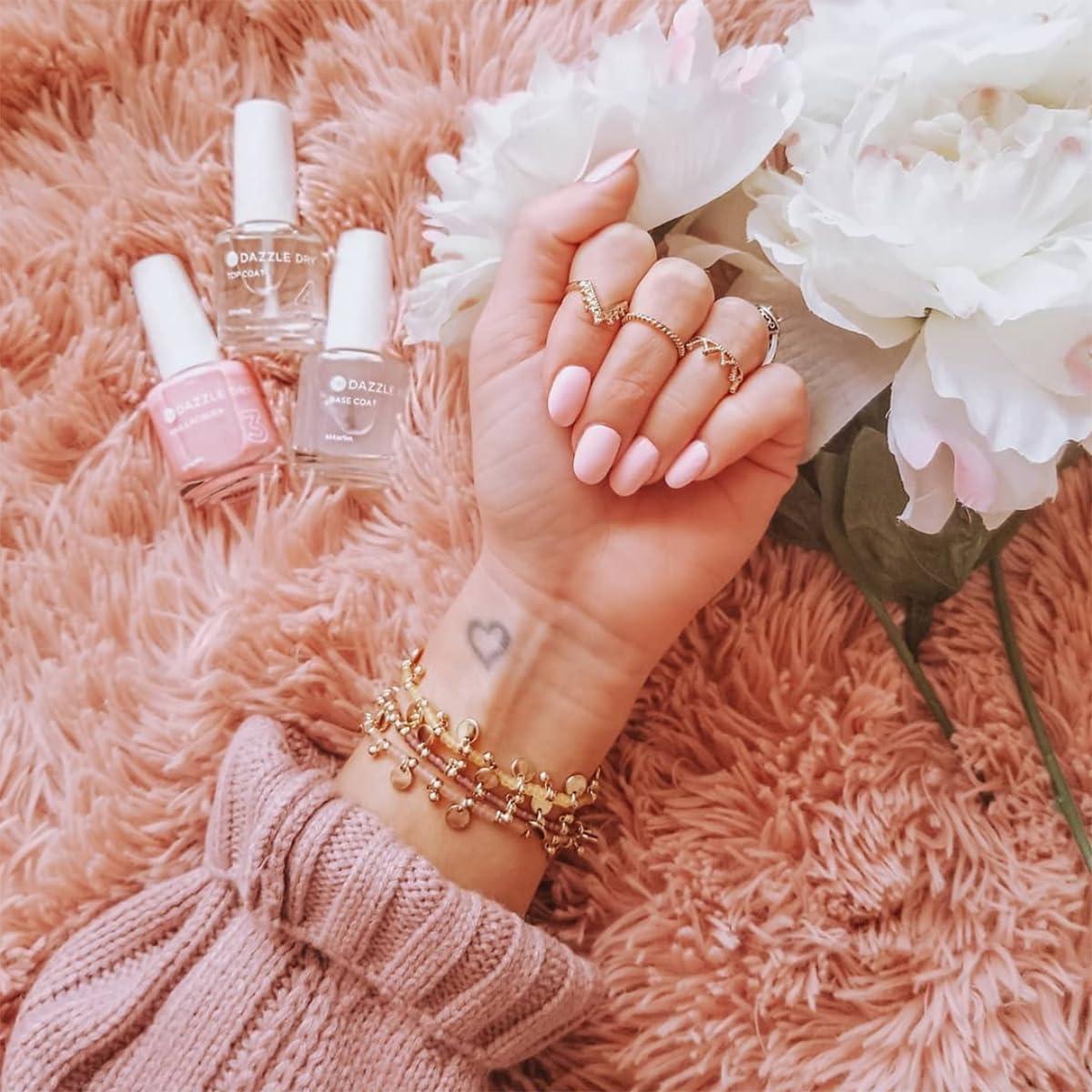 Lifestyle image of a person stretching in yoga pose with Dazzle Dry nails for polished look
