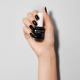 Dazzle Dry swatches on nail wheel displaying true black shade and full-coverage finish