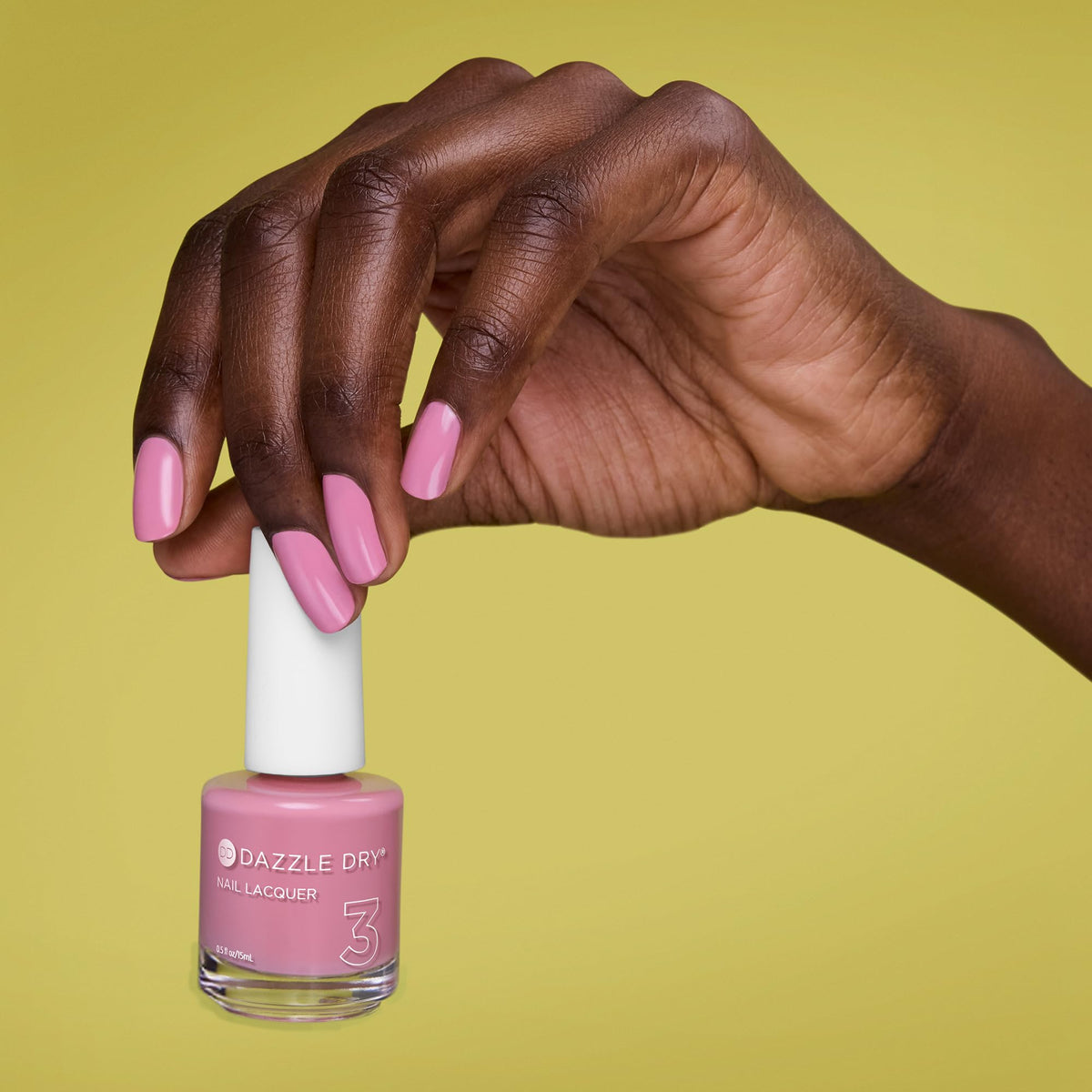 Dazzle Dry lacquer being applied to nail showing precise brush and quick-dry benefit
