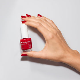 Natural nails painted with Dazzle Dry Rapid Red showing durable shine benefit