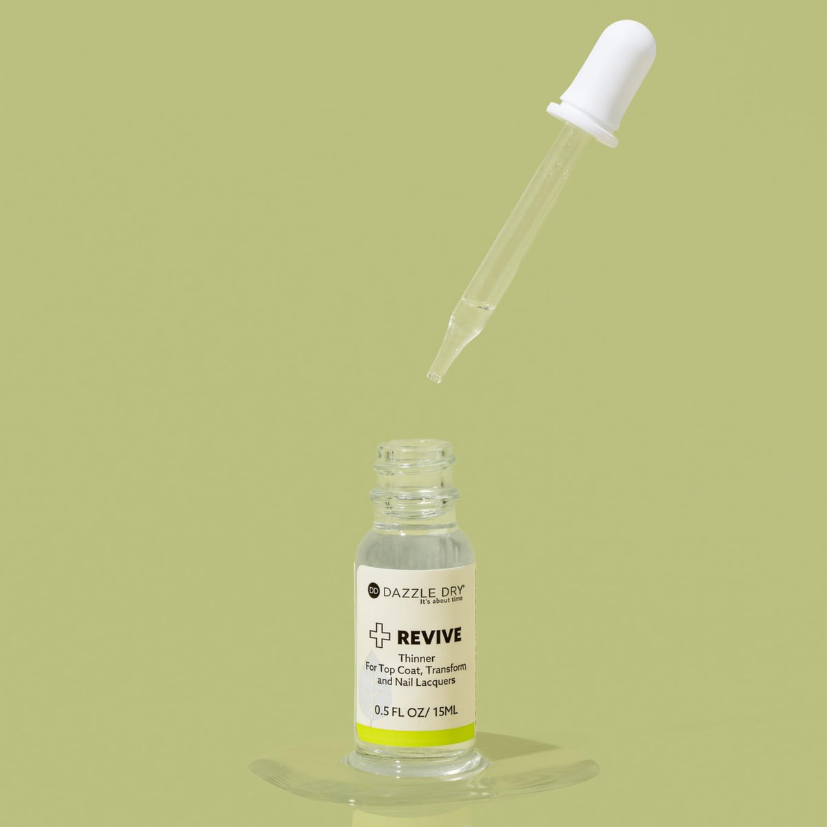 Close-up of Dazzle Dry Revive liquid texture showing smooth solvent clarity