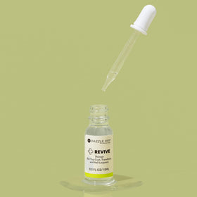 Close-up of Dazzle Dry Revive liquid texture showing smooth solvent clarity