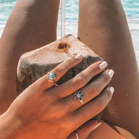 Dazzle Dry manicure on hands in a lifestyle setting showing polished finish