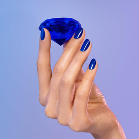 Dazzle Dry Saphira being applied in hand for quick, salon-quality results