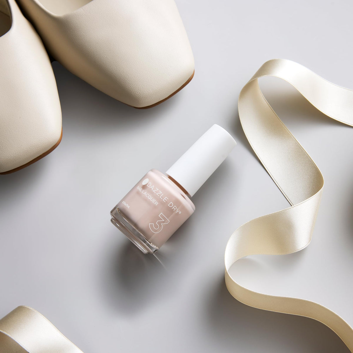 Dazzle Dry lacquer applied on natural nails demonstrating fast-dry finish and chip resistance