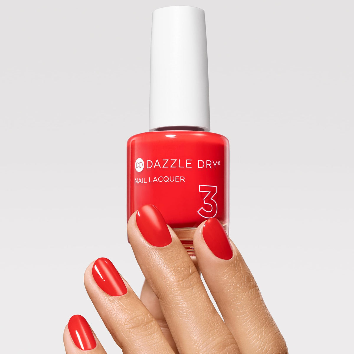 Dazzle Dry bottle cap and neck close-up highlighting controlled brush and precision