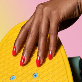 Dazzle Dry applying Spark on a nail illustrating quick application and neat coverage