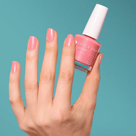 Dazzle Dry swatch on nails displaying buildable opacity and natural finish benefit