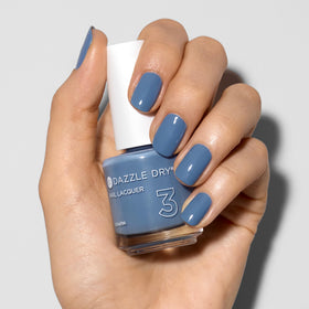 Dazzle Dry on natural nails displaying muted light denim wear