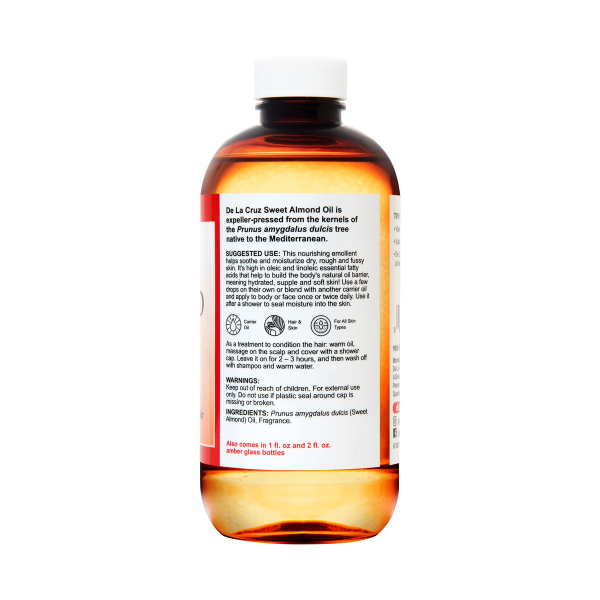 De La Cruz almond oil open cap with drop forming illustrating easy dispensing