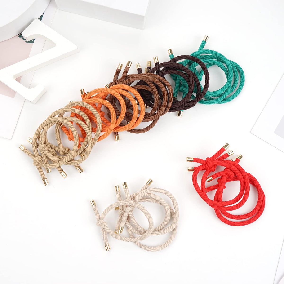 DealEachDay hair tie held next to a coin showing scale and travel-friendly portability