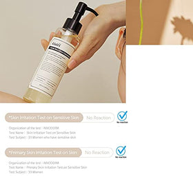 DearKlairs bottle next to a passport showing travel-friendly size benefit