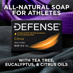 Defense Soap citrus bar held in hand showing true 4.2 oz scale