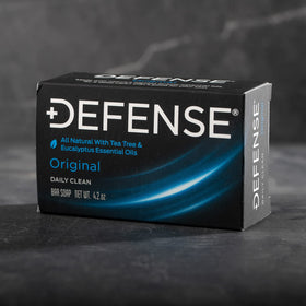 Defense Soap packed inside a gym bag with towel, ideal for athletes and commuters