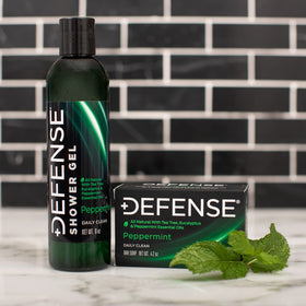 Defense Soap used in gym shower demonstrating post-workout cleansing
