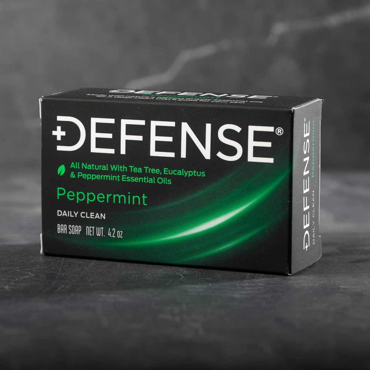 Defense Soap label ingredient closeup listing tea tree, peppermint, eucalyptus for transparency benefit