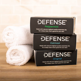 Defense Soap Original bar label visible showing tea tree ingredients