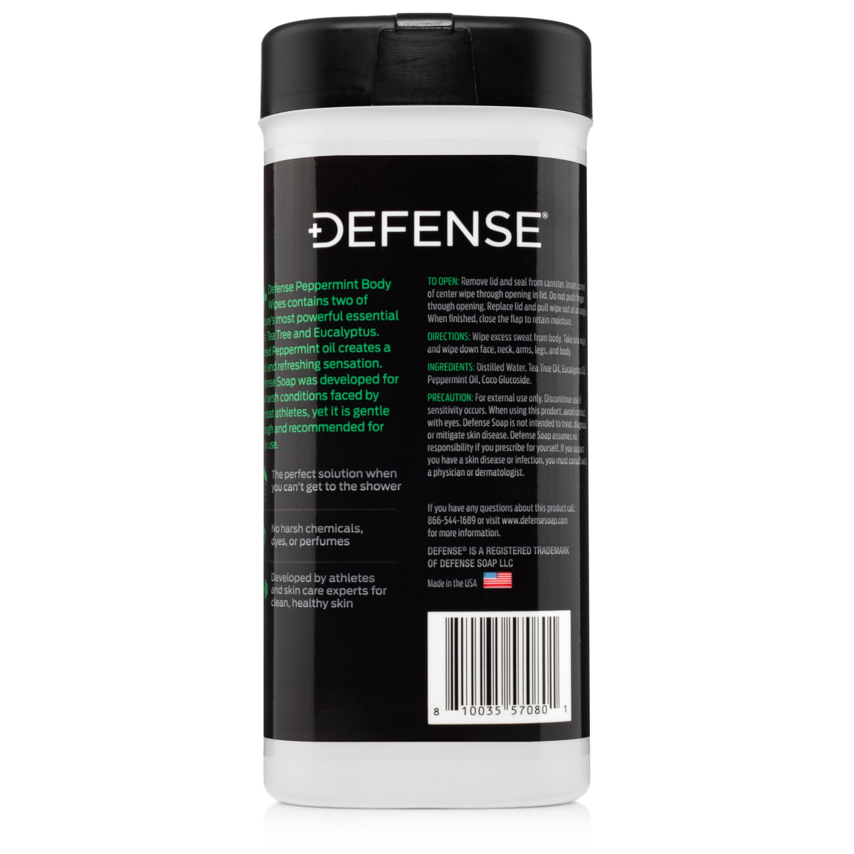 Peppermint leaf and tea tree sprig near Defense Soap wipes emphasizing natural oils