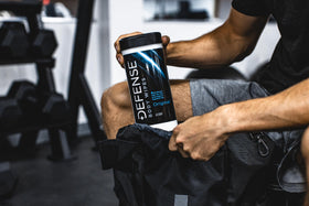 Defense Soap wipe cleaning gym equipment and reducing grime