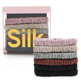 DEMAZALO front packaging showing six silk scrunchies and neat storage — elegant gift appeal