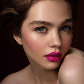 Depuplum liquid swatches on arm displaying Dream Pink pigment and coverage