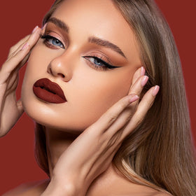 depuplum swatch on arm rich oxblood red pigment that stays intense