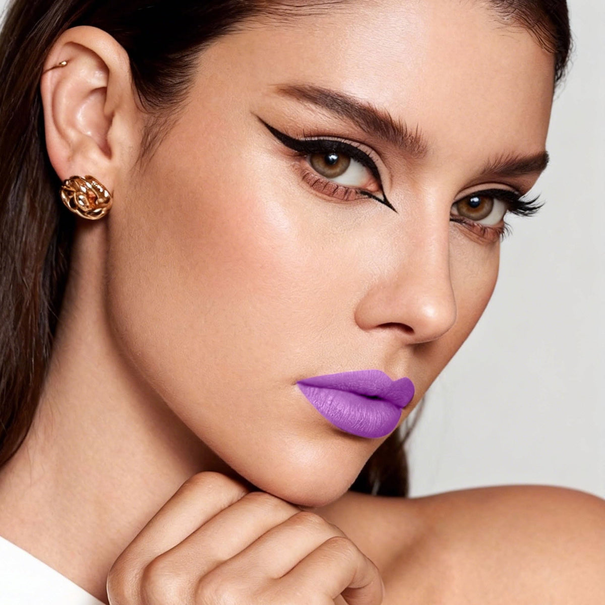 Depuplum purple lipstick swatch texture on arm showing intense matte payoff