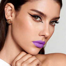 Depuplum purple lipstick swatch texture on arm showing intense matte payoff