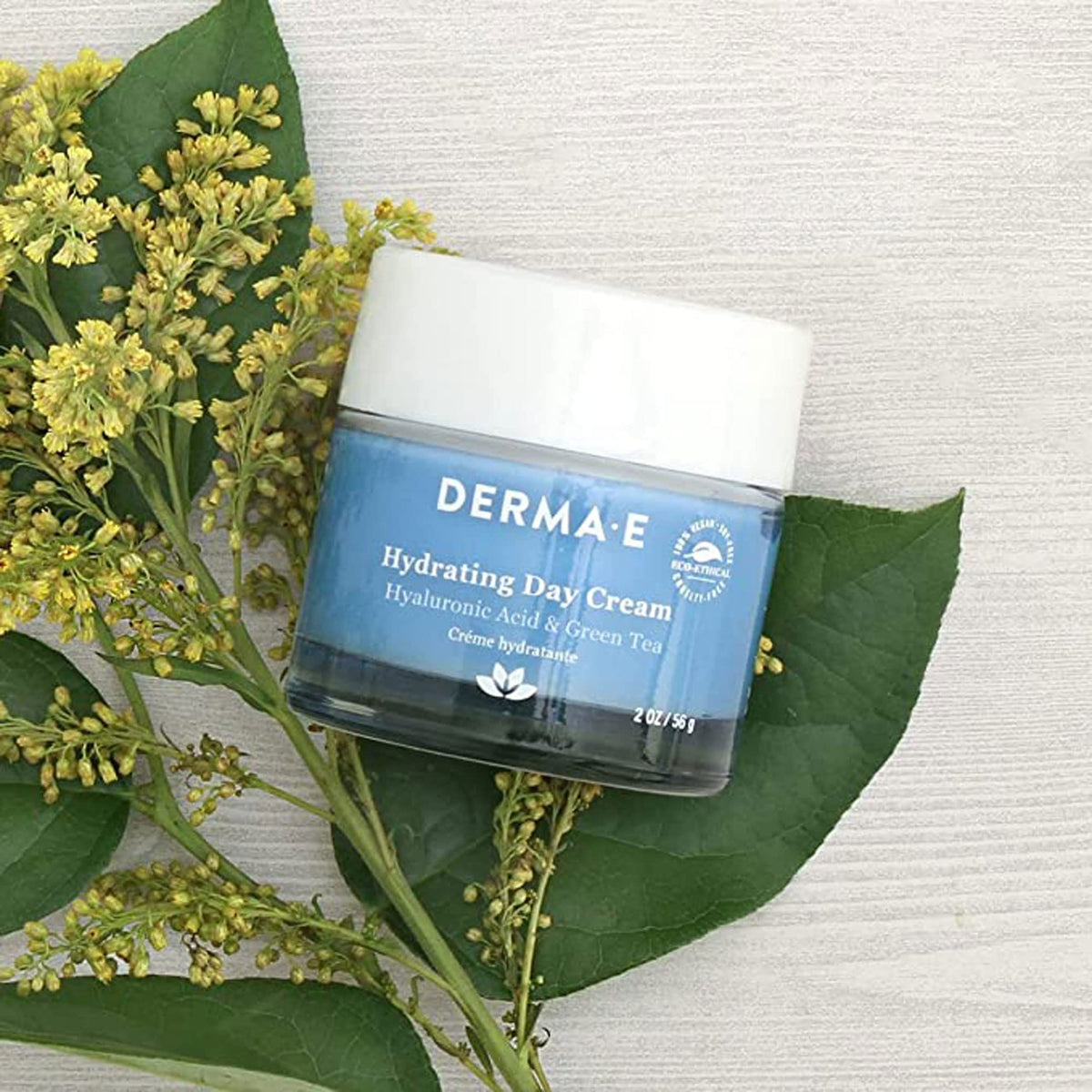 DERMA E cream on fingertip ready for quick application benefit
