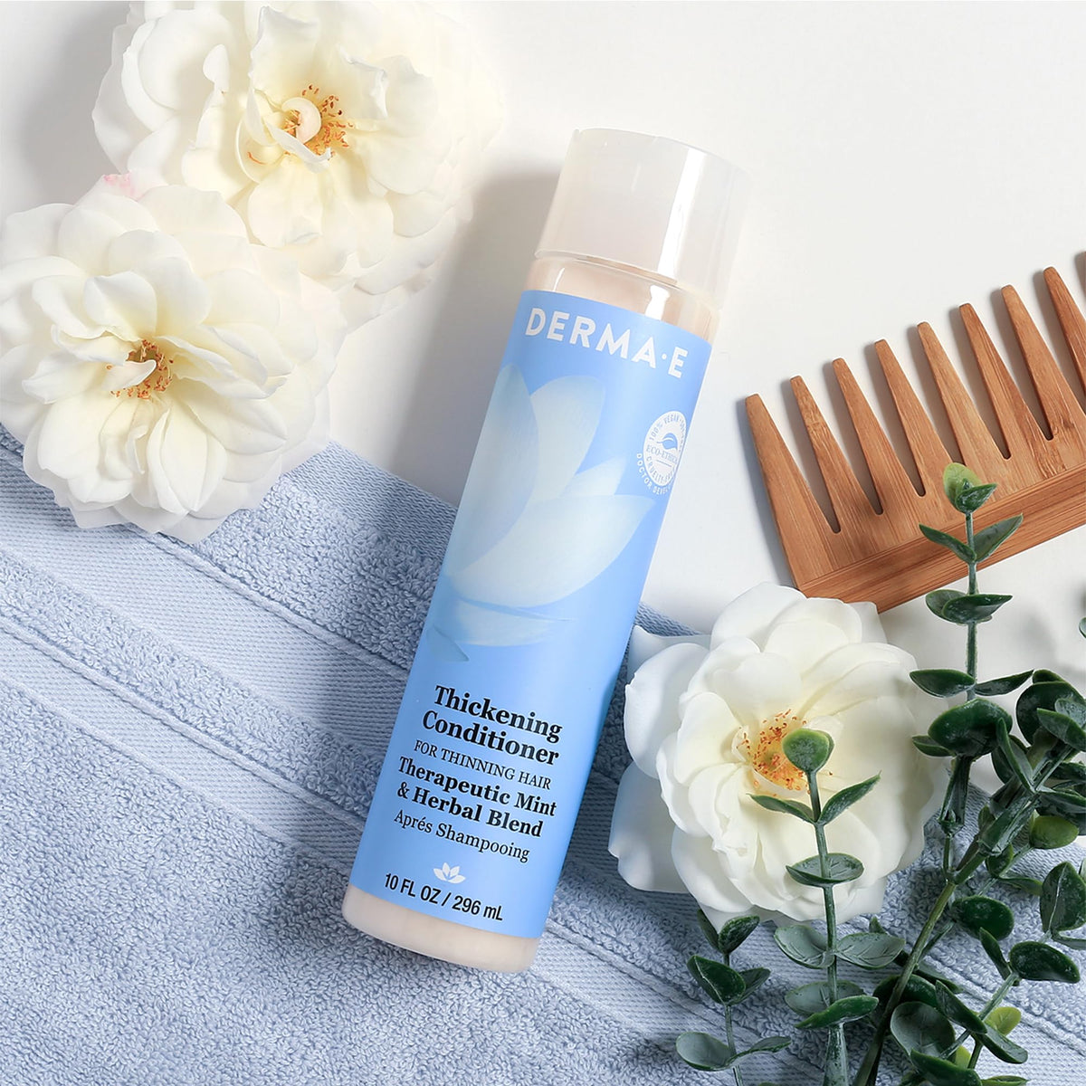 Derma E conditioner in shower showing use after shampoo for fuller-looking hair