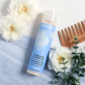 Derma E conditioner in shower showing use after shampoo for fuller-looking hair