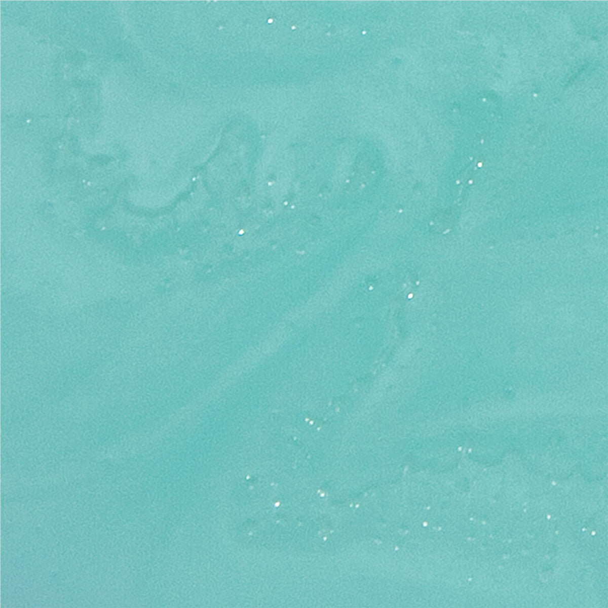 derma-e product being massaged into scalp for calming benefit
