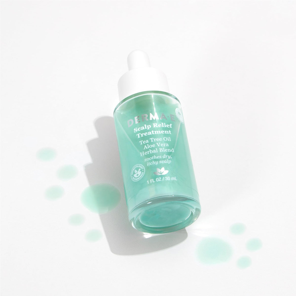 derma-e 1 fl oz bottle next to a coin showing convenient travel benefit
