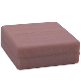 Dermaharmony bar held in hand for scale, showing compact travel-friendly size